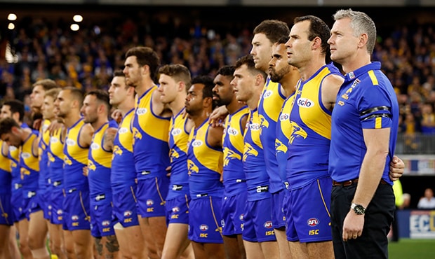 AFL 2018 Second Qualifying Final - West Coast v Collingwood PERTH, AUSTRALIA - SEPTEMBER 08: Adam Simpson, Senior Coach of the Eagles lines up for the national anthem with players during the 2018 AFL Second Qualifying Final match between the West Coast Eagles and the Collingwood Magpies at Optus Stadium on September 08, 2018 in Perth, Australia. (Photo by Adam Trafford/AFL Media)